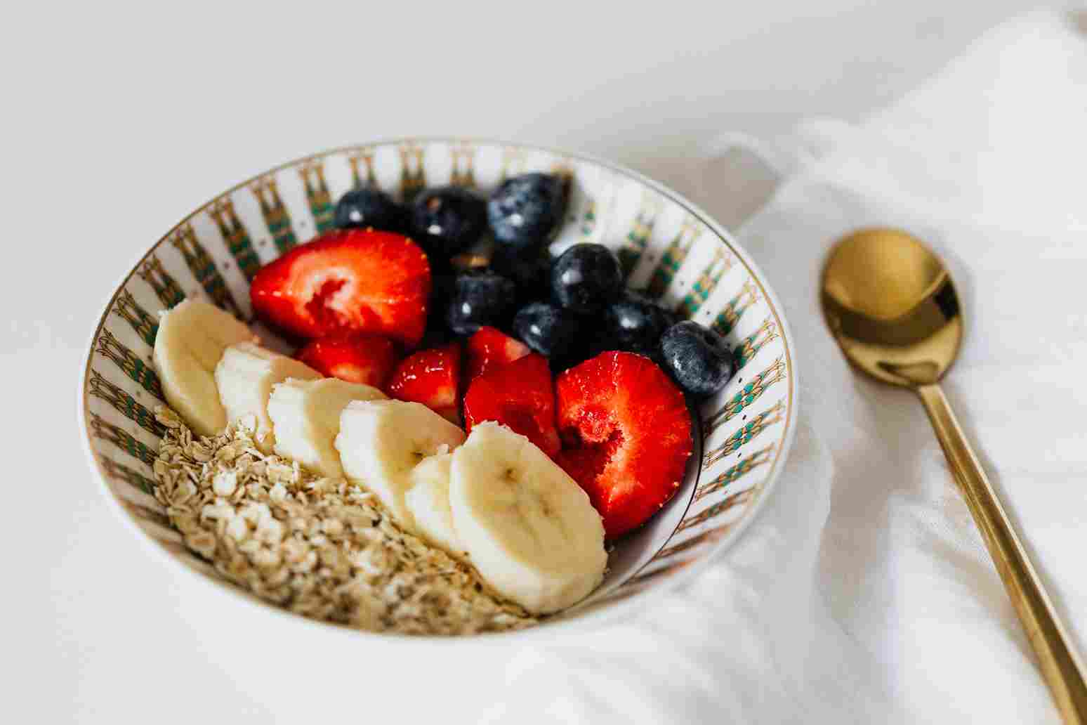 Bowl of oats with fruits and berries
